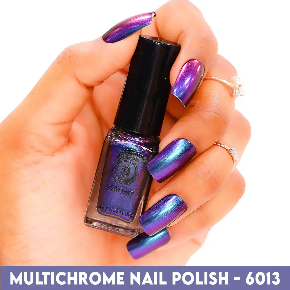 Bottle of color-shifting Purple Green Red Gold multichrome nail polish with high-gloss finish